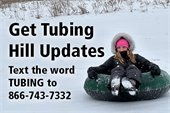 A photo of a snow tuber in the forest preserve.