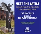 A photo of sculpture artist Jen Kresl posing with her sculpture "Tribute" on Bob Walters Commons.