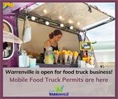 A photo of a woman operating a food truck. The City now offers mobile food truck permits.