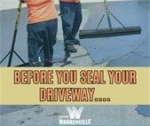 A photo of two men sealing a driveway with products approved by the City.