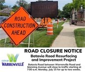 A photo of a sign that says "Road Construction Ahead" for the Batavia Road Project.