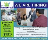 A photo of customer service staff, a diverse group of men and women, helping customers at a desk.