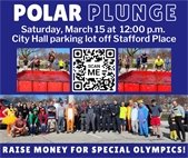 A photo of police and firefighters participating the Polar Plunge fundraiser for Special Olympics by jumping into a cold pool.