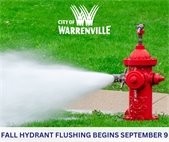 A photo of a fire hydrant being flushed. Public Works will flush fire hydrants through the beginning of October.