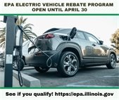 A photo of an electric vehicle at a charging station to promote the EV Rebate Program. 