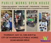 A photo of Public Works staff and kids at last year's Public Works Dept. open house.