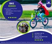 An image of a girl riding a bike on a skills course to promote the Bike Rodeo on May 18.