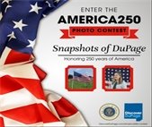 Graphic promoting the America250 Photo Contest titled “Snapshots of DuPage: Honoring 250 years of America.” The design features a large American flag draped along the left side. Text reads “Enter the America250 Photo Contest.” Two sample images appear below: one shows several American flags displayed outdoors on a grassy field, and the other shows a woman singing into a microphone in front of an American flag backdrop. Logos for the County of DuPage and Discover DuPage appear at the bottom with the website DiscoverDuPage.com/America250-Contest.