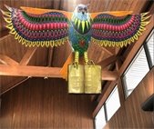 A photo of the alebrije artwork, Buck the Owl, on display at Warrenville Public Library.