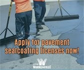 A photo of two men applying sealant to a driveway. It's a reminder to contractors to renew their licenses.