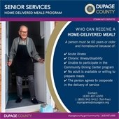 A photo of a senior citizen receiving a meal delivery.