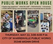 A photo from last year's Public Works Department open house showing staff interacting with residents.