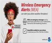 An image of a woman receiving an emergency alert on her smartphone.